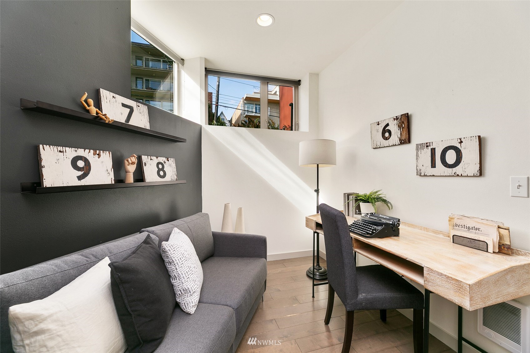 327 West Olympic Place, Unit F Seattle, WA 98119 - Photo 20 of 39 a living room with furniture and painting on the wall