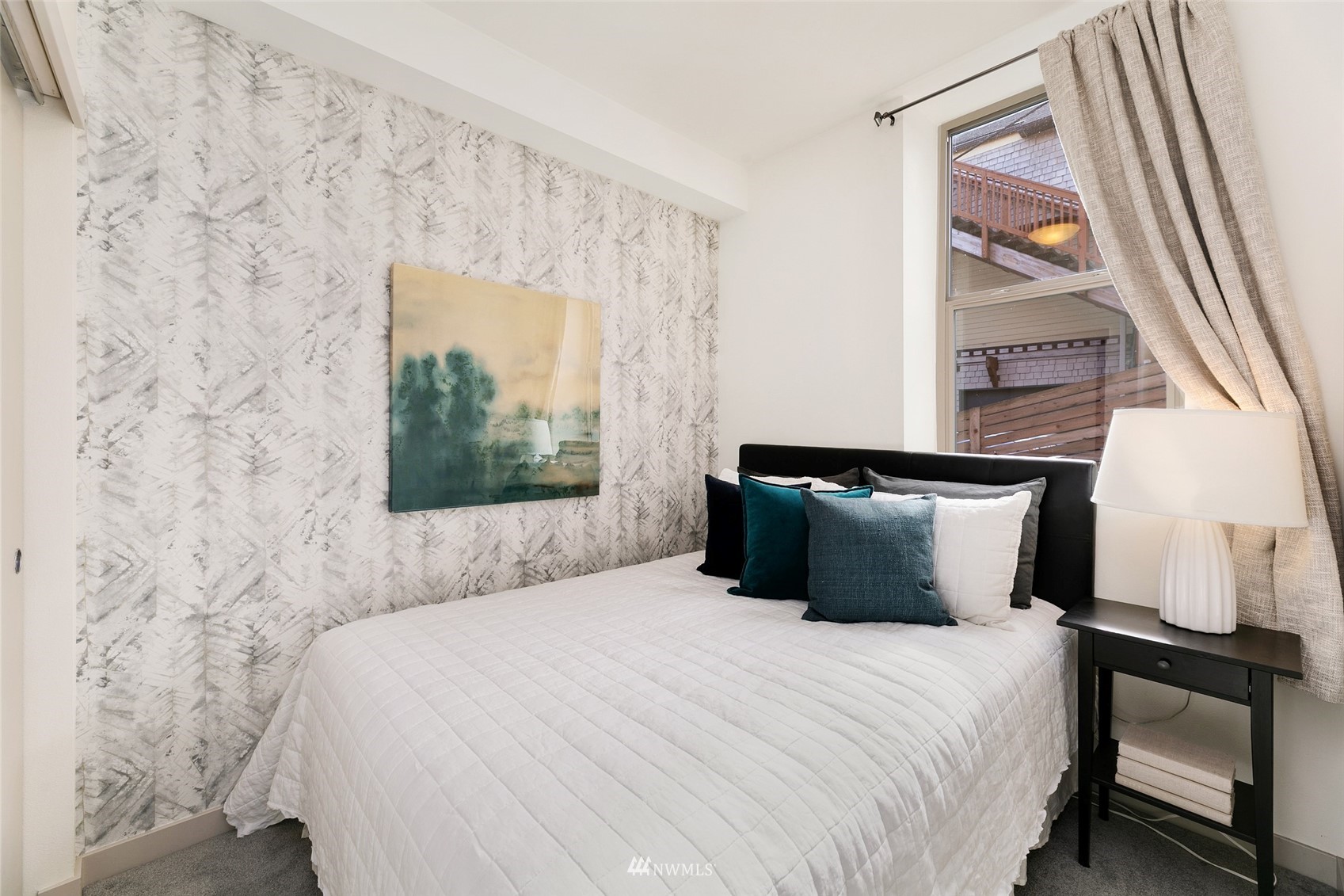 327 West Olympic Place, Unit F Seattle, WA 98119 - Photo 21 of 39 a bedroom with a bed and a window