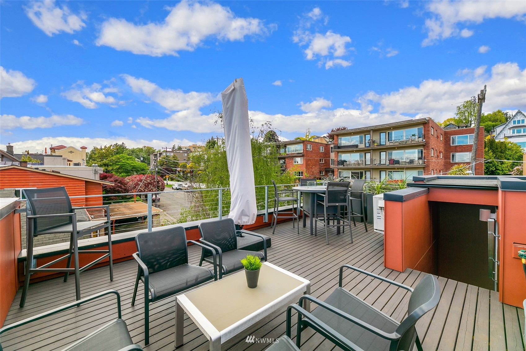 327 West Olympic Place, Unit F Seattle, WA 98119 - Photo 25 of 39 a view of a terrace with furniture