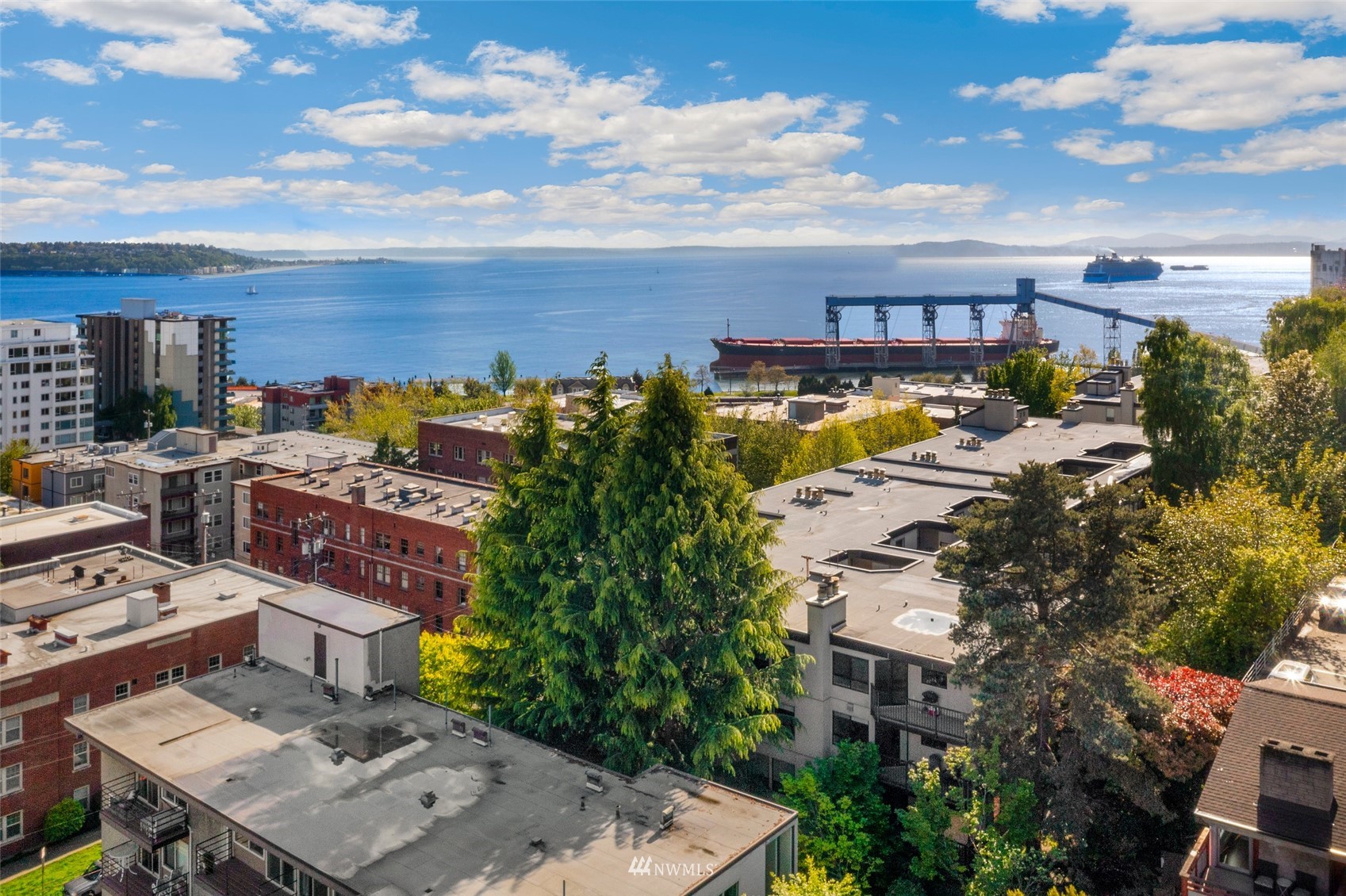 327 West Olympic Place, Unit F Seattle, WA 98119 - Photo 27 of 39 a view of a city with tall buildings