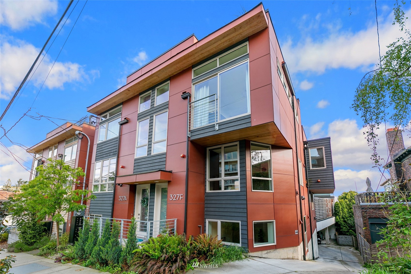 327 West Olympic Place, Unit F Seattle, WA 98119 - Photo 3 of 39 a front view of a multi story residential apartment building