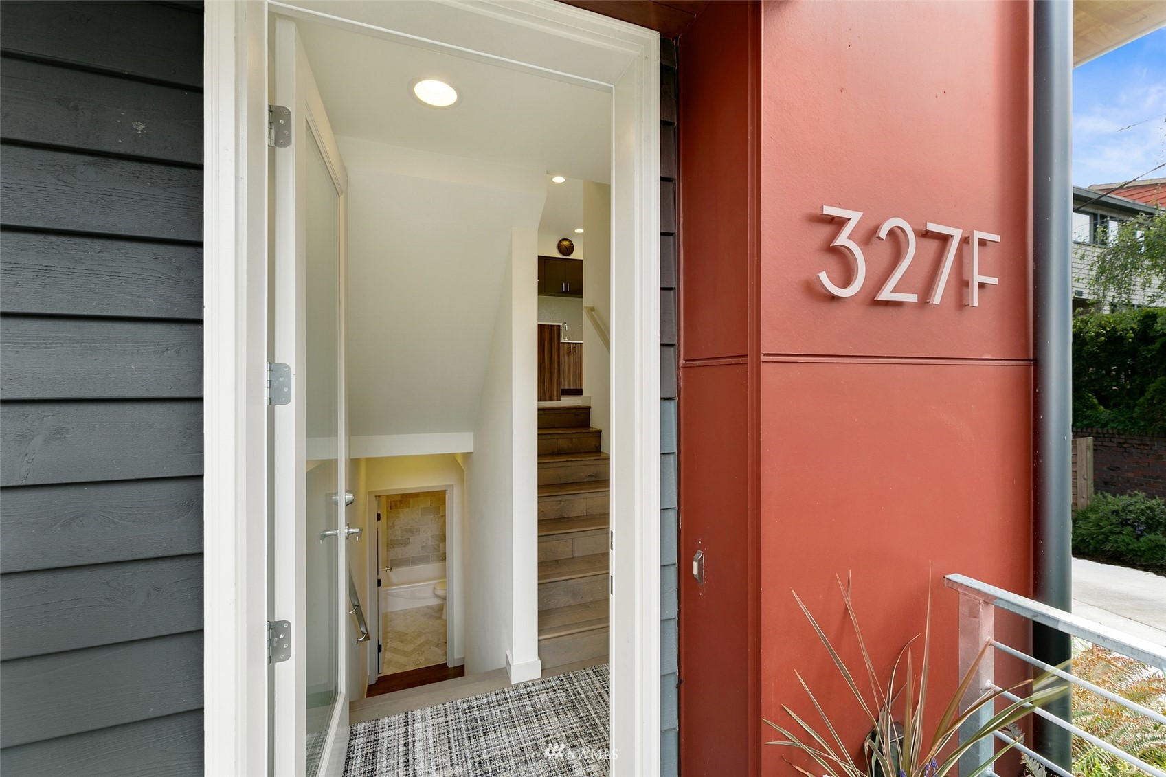 327 West Olympic Place, Unit F Seattle, WA 98119 - Photo 4 of 39 a view of a door and an outdoor space