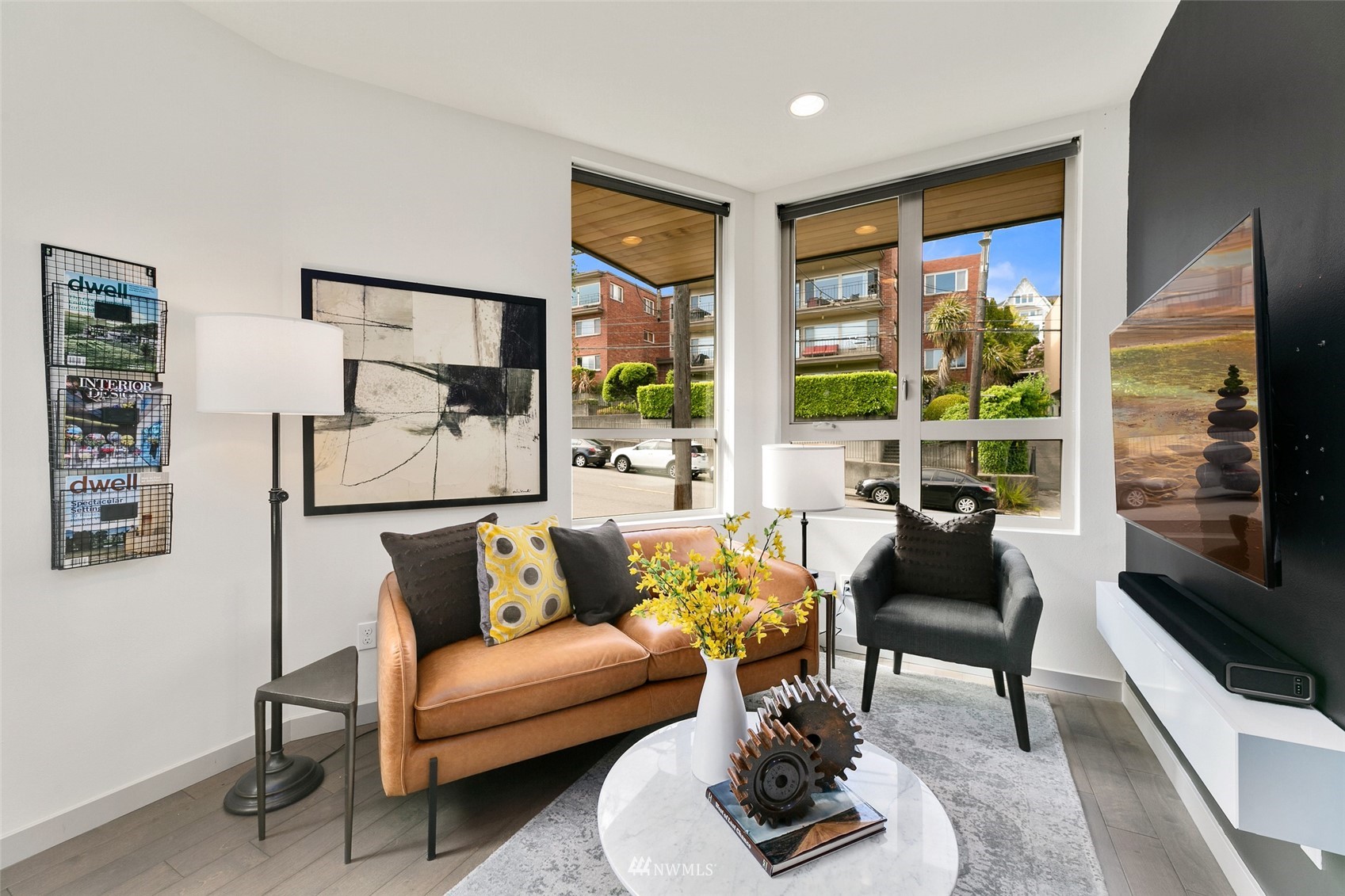 327 West Olympic Place, Unit F Seattle, WA 98119 - Photo 10 of 39 a living room with furniture and a flat screen tv