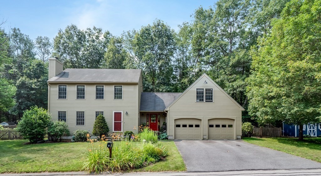 4 Crabtree Lane Shirley, MA 01464 - Photo 1 of 36 a view of house with garden and tall trees