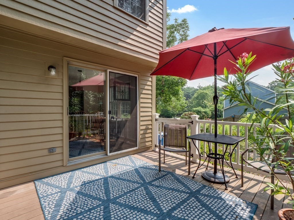 4 Crabtree Lane Shirley, MA 01464 - Photo 14 of 36 a patio with table and chairs