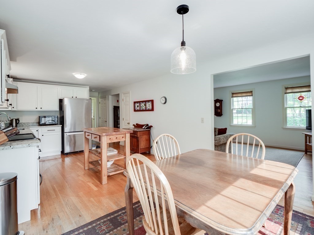 4 Crabtree Lane Shirley, MA 01464 - Photo 15 of 36 a dining room with furniture a chandelier and wooden floor