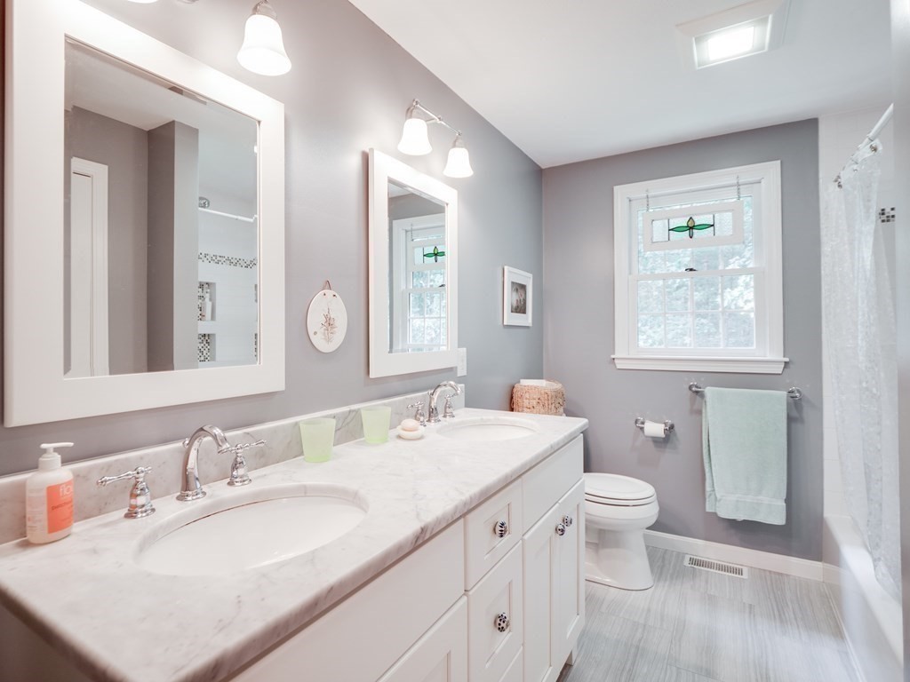 4 Crabtree Lane Shirley, MA 01464 - Photo 28 of 36 a bathroom with a granite countertop double vanity sink a mirror and a toilet
