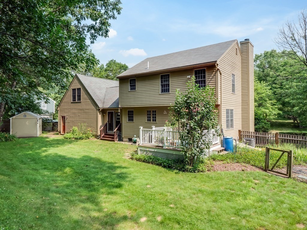 4 Crabtree Lane Shirley, MA 01464 - Photo 32 of 36 a front view of house with yard and green space