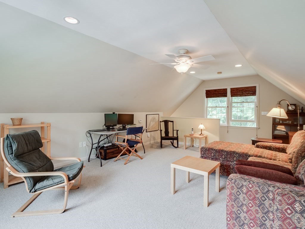 4 Crabtree Lane Shirley, MA 01464 - Photo 6 of 36 a living room with furniture and a chandelier