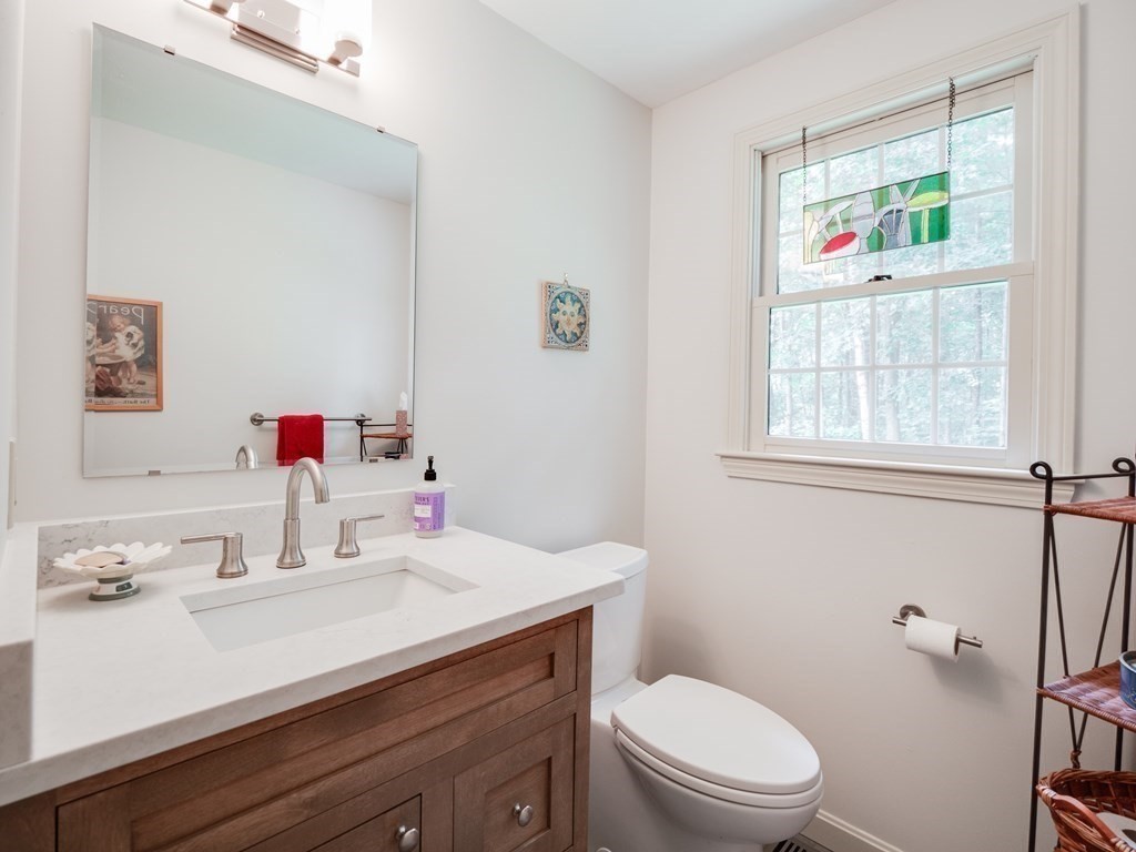 4 Crabtree Lane Shirley, MA 01464 - Photo 8 of 36 a bathroom with a sink a toilet and a window