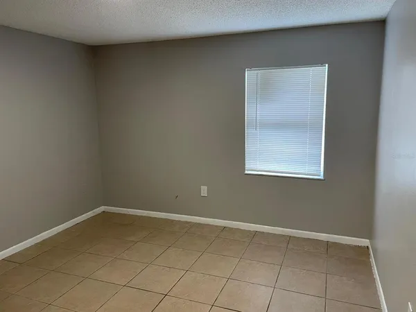 an empty room with mirror