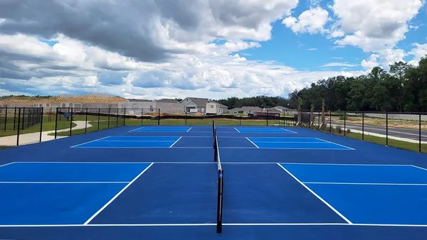 a view of an outdoor space and tennis court