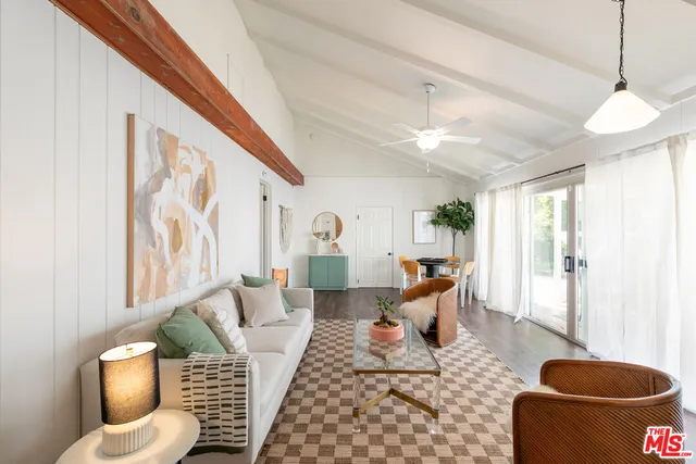 a view of a room with wooden floor and windows