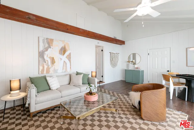 a bed room with a bed and a chandelier