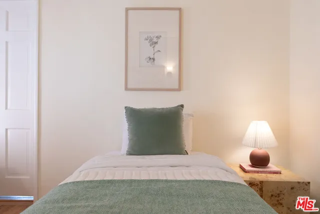 a bed room with a bed and a couch