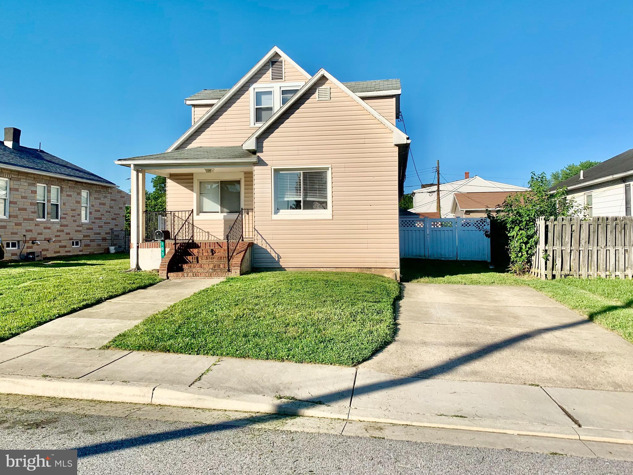 103 North Stuart Street Baltimore, MD 21221 - Photo 1 of 11 Front with yard, sidewalk, and private driveway.