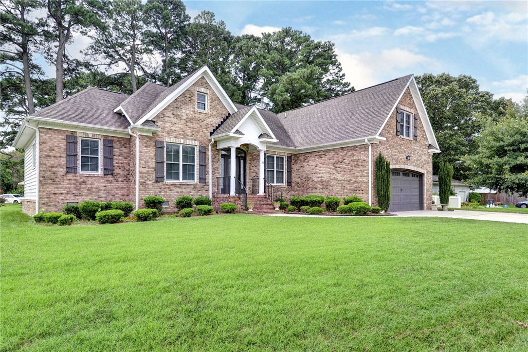 11 Butler Farm Road Hampton, VA 23666 - Photo 3 of 39 Craftsman-style home featuring brick siding, roof with shingles, an attached garage, driveway, and a front yard
