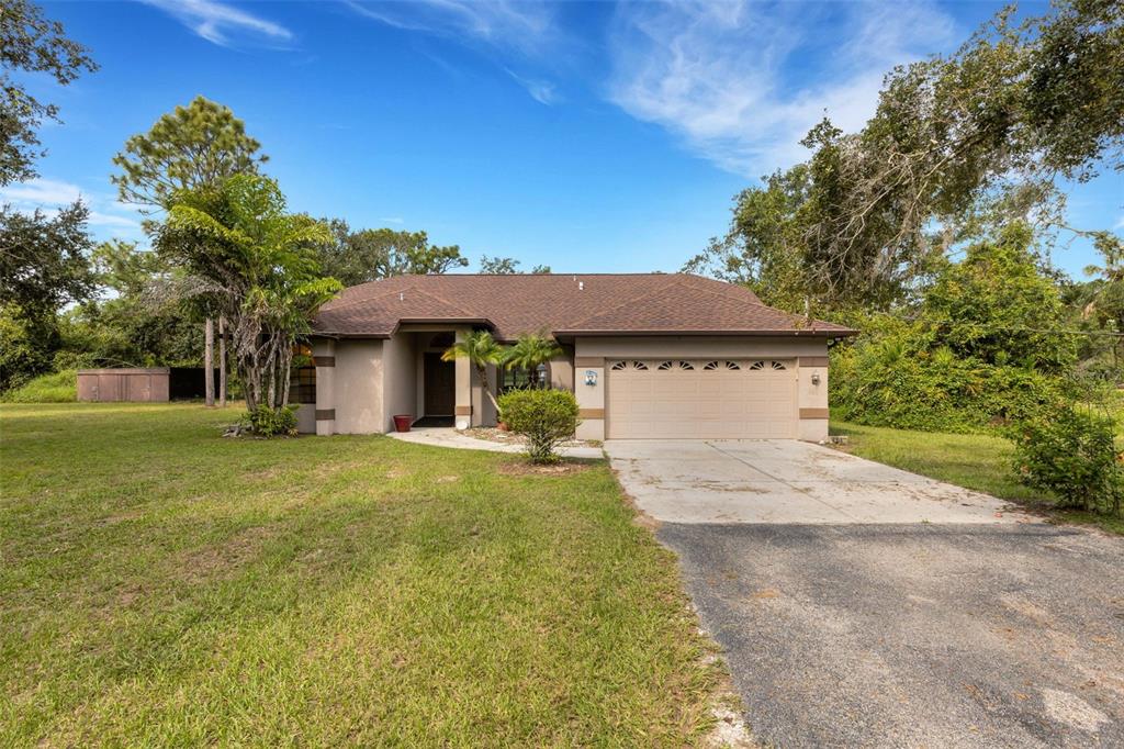 3305 Long Rifle Drive Wimauma, FL 33598 - Photo 1 of 1 a front view of a house with yard