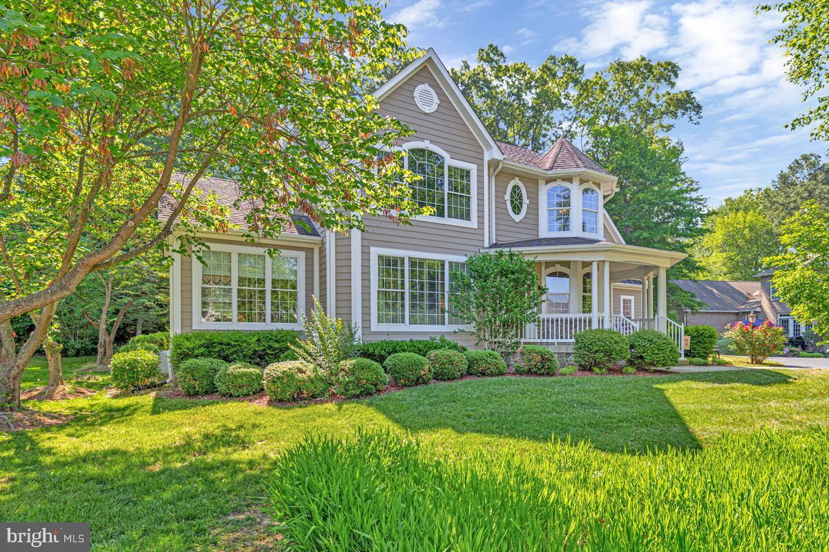 11565 Magnolia Court Issue, MD 20645 - Photo 3 of 68 a front view of a house with a yard