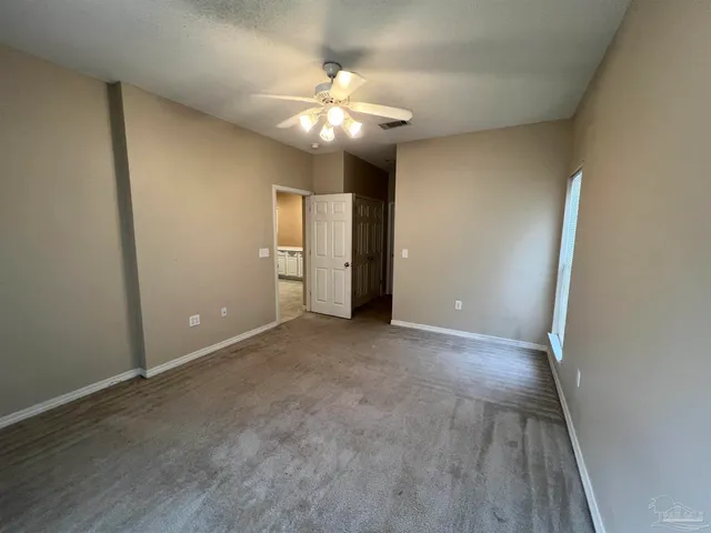 a view of a bathroom from the hallway