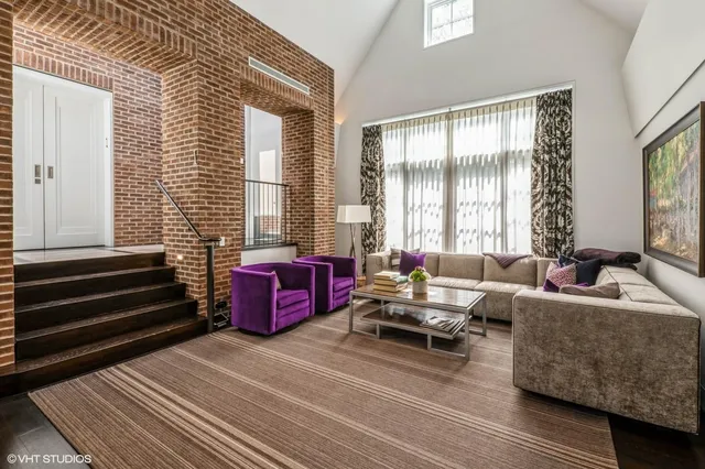 a living room with furniture and windows