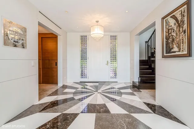 a view of a bedroom with wooden floor and windows