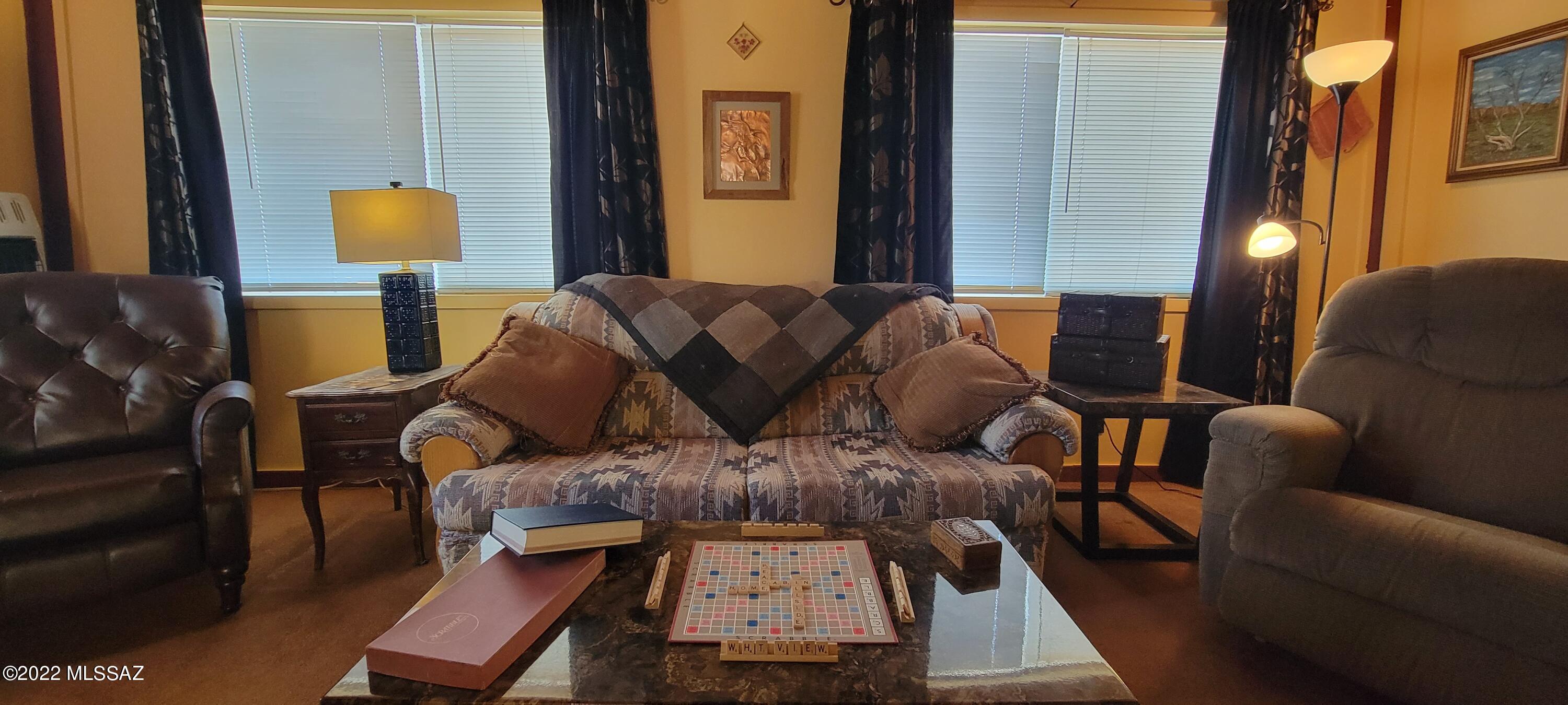3399 Red Stag Road Pearce, AZ 85625 - Photo 25 of 47 a living room with furniture and a lamp