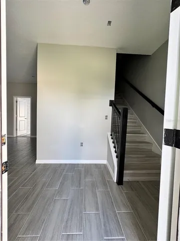 a view of entryway with wooden floor