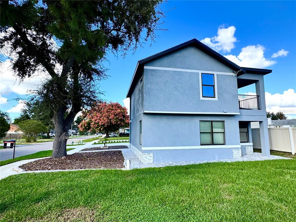 101 Grove Street Orlando, FL 32835 - Photo 2 of 57 a view of a house with a yard