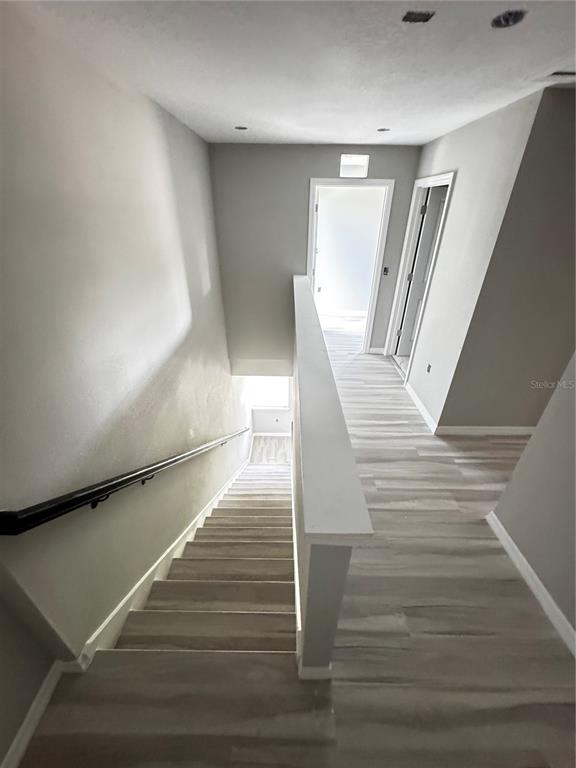 101 Grove Street Orlando, FL 32835 - Photo 24 of 57 a view of entryway and hall with wooden floor