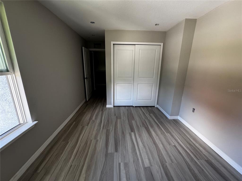 101 Grove Street Orlando, FL 32835 - Photo 26 of 57 a view of a room with wooden floor and window