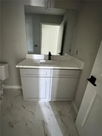 a view of a room with wooden floor and window