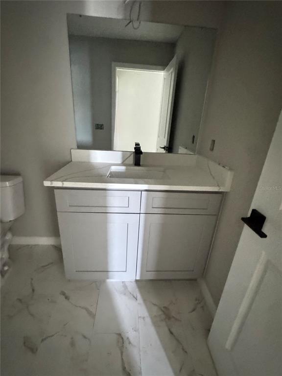 101 Grove Street Orlando, FL 32835 - Photo 30 of 57 a bathroom with a sink and mirror