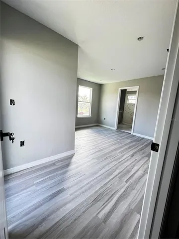 a view of balcony with wooden floor
