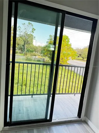 a view of a room with wooden floor and staircase