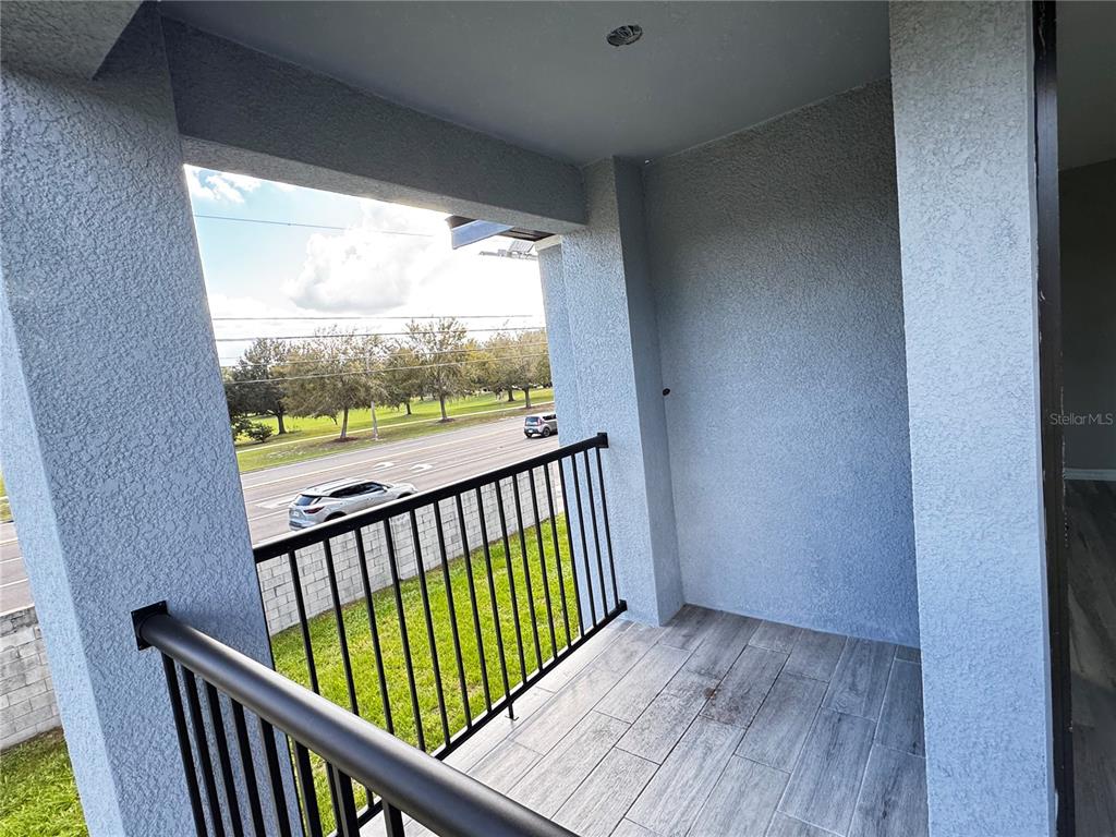 101 Grove Street Orlando, FL 32835 - Photo 36 of 57 a view of a porch with wooden floor