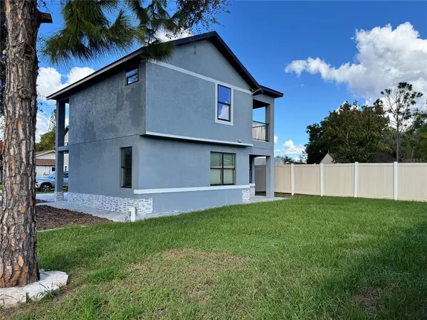 a view of a back yard of the house