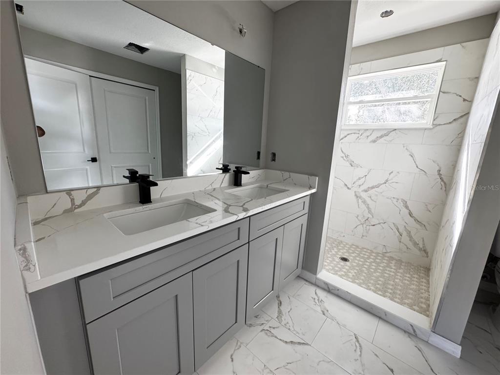 101 Grove Street Orlando, FL 32835 - Photo 46 of 57 a bathroom with a sink and a mirror