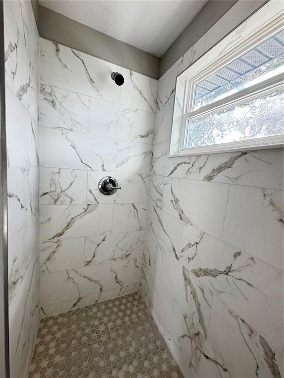 101 Grove Street Orlando, FL 32835 - Photo 48 of 57 a bathroom with a shower