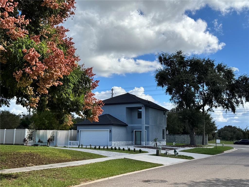 101 Grove Street Orlando, FL 32835 - Photo 5 of 57 a view of a house with a swimming pool and a yard