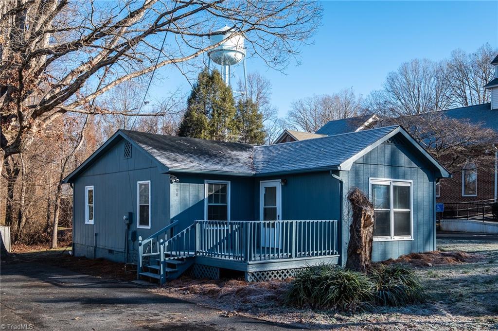 108 Reeves Lane Elkin, NC 28621 - Photo 2 of 20 Front exterior of home features nice deck and fresh coat of paint.