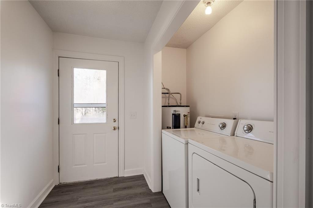 108 Reeves Lane Elkin, NC 28621 - Photo 11 of 20 Laundry room is located at the end of the kitchen with door leading to back deck.