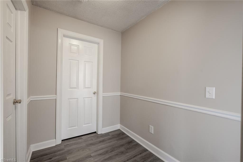 108 Reeves Lane Elkin, NC 28621 - Photo 17 of 20 Back hallway leading to bedrooms and bathroom.