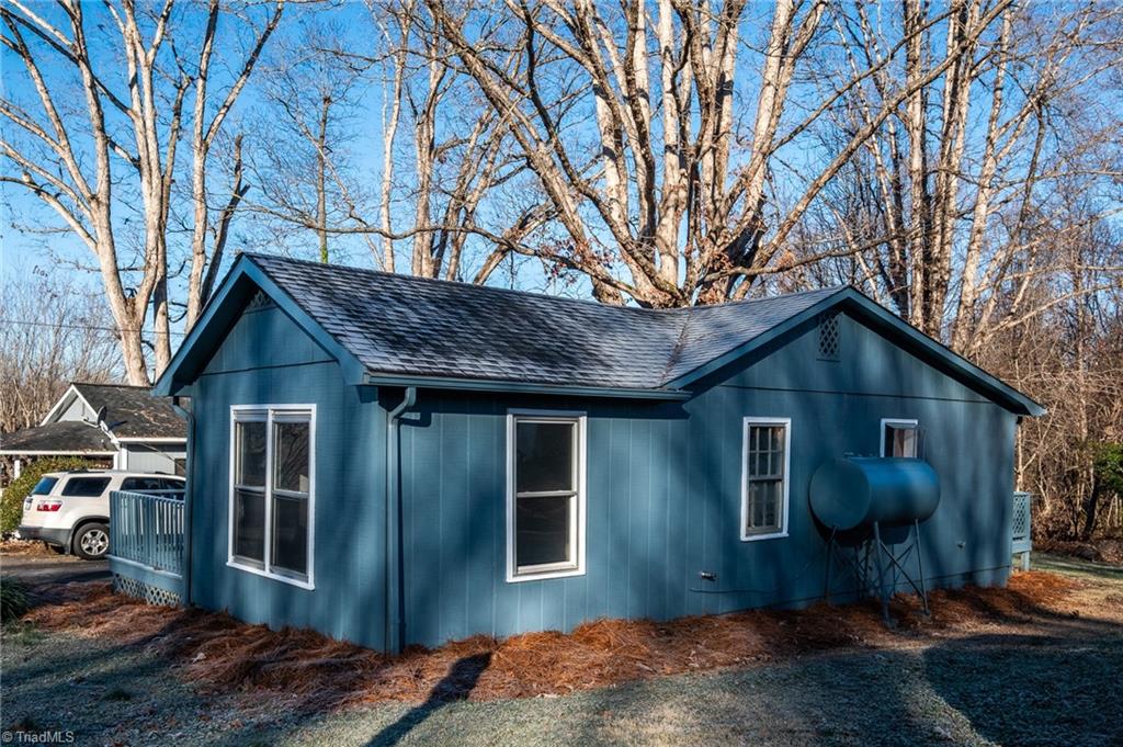 108 Reeves Lane Elkin, NC 28621 - Photo 5 of 20 Front and side view of home. Some new windows installed in 2010. Roof installed in 2018.
