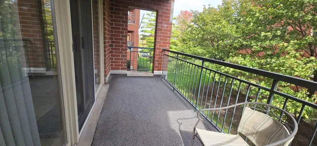 a view of balcony with wooden floor and outdoor seating