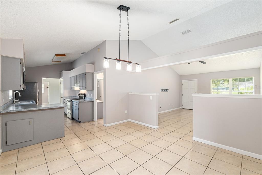 21 Pecan Course Circle Ocala, FL 34472 - Photo 12 of 46 a view of a kitchen with furniture and a window