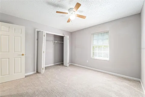 a bathroom with a sink a toilet a mirror a bathtub and shower