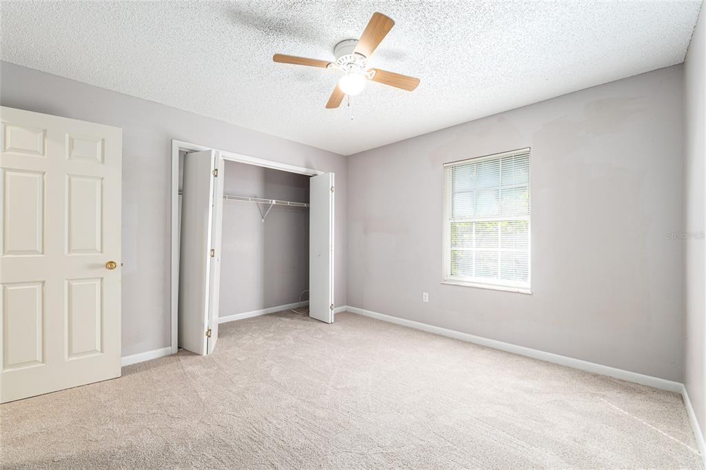 21 Pecan Course Circle Ocala, FL 34472 - Photo 29 of 46 an empty room with fan and windows