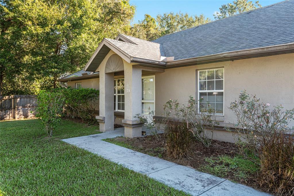 21 Pecan Course Circle Ocala, FL 34472 - Photo 3 of 46 a front view of house with yard and green space