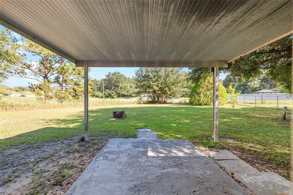 21 Pecan Course Circle Ocala, FL 34472 - Photo 37 of 46 a view of a porch with a big yard